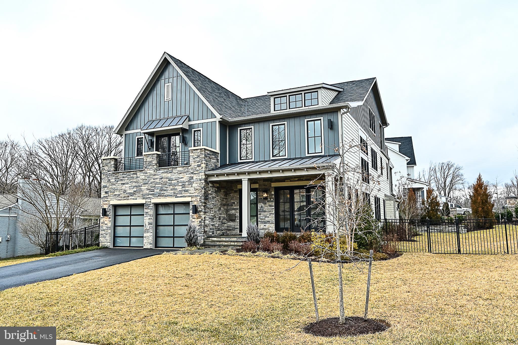 7126 Merrimac Drive McLean, VA 22101 - Photo 6 of 98 a front view of a house with a yard