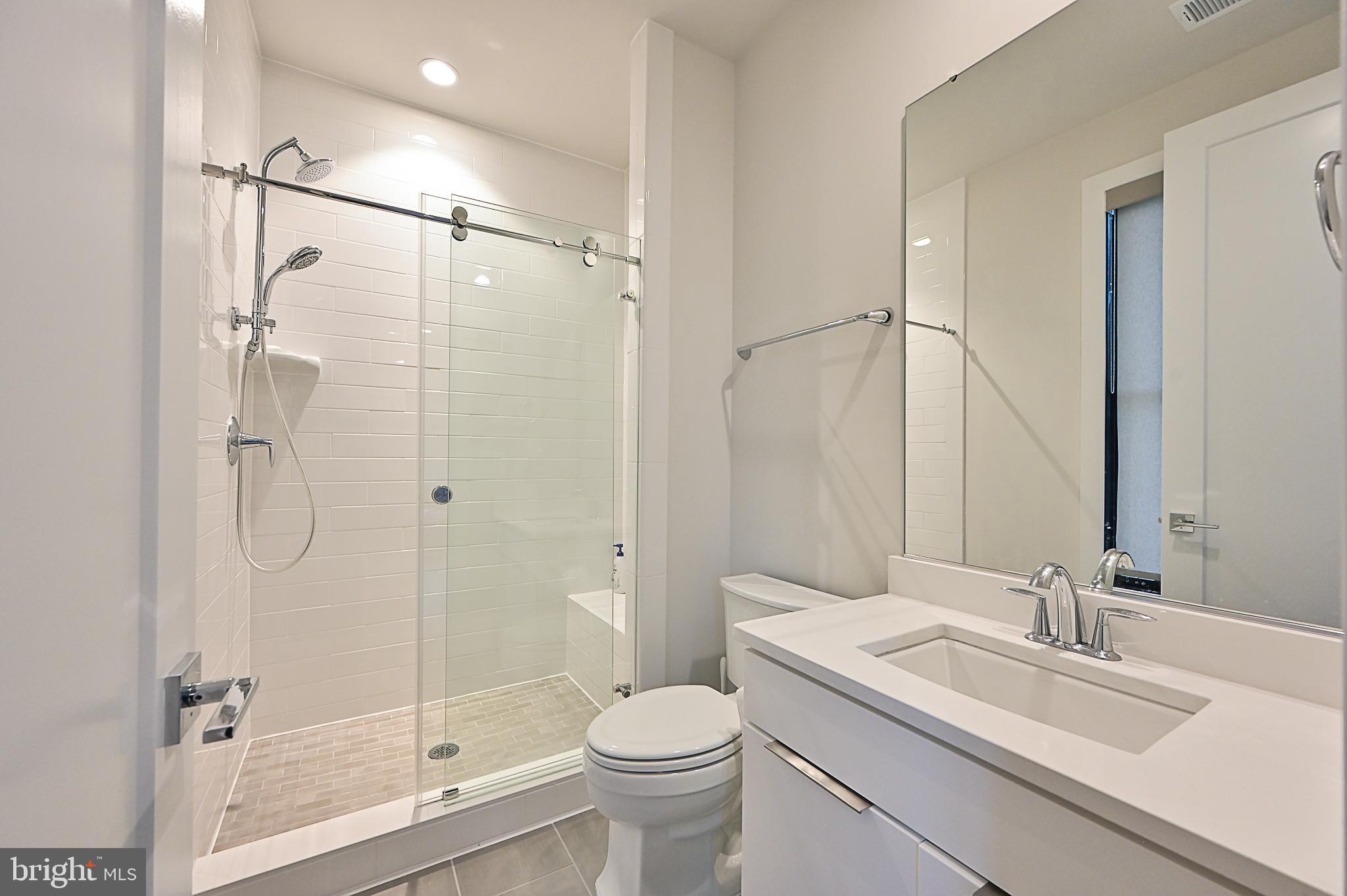 7126 Merrimac Drive McLean, VA 22101 - Photo 56 of 98 a bathroom with a sink toilet and shower
