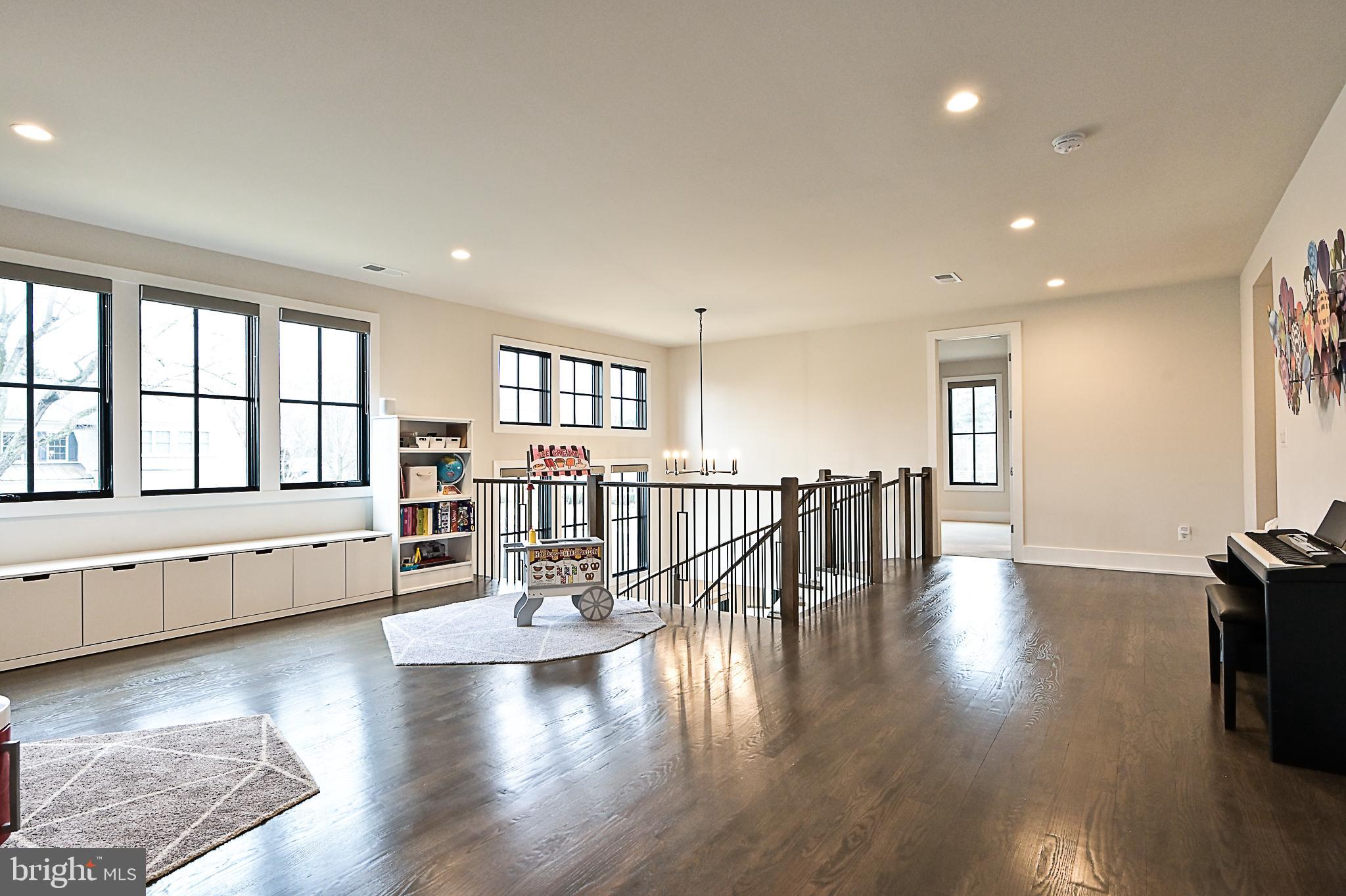 7126 Merrimac Drive McLean, VA 22101 - Photo 58 of 98 a view of an empty room with wooden floor and a window