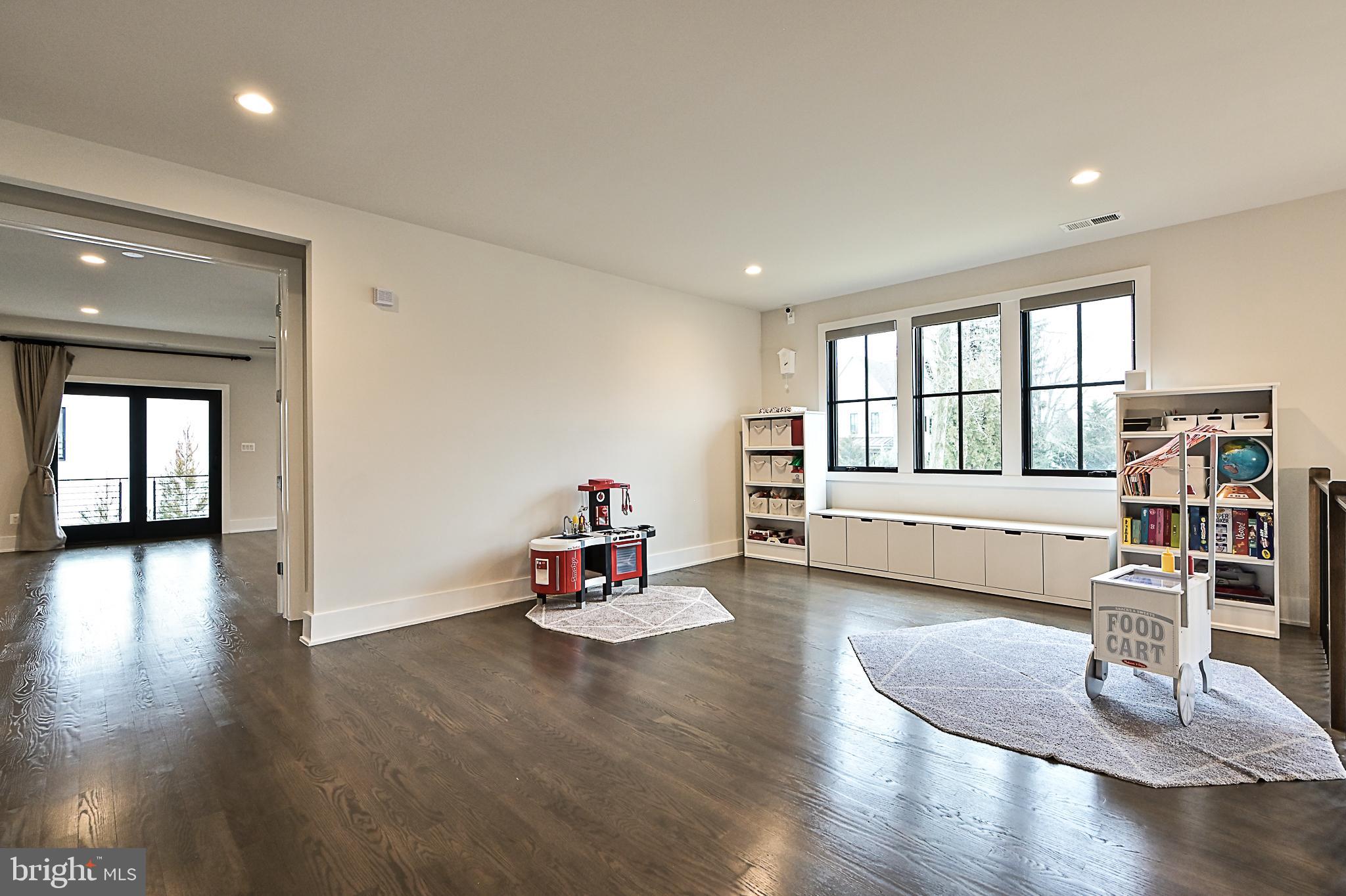 7126 Merrimac Drive McLean, VA 22101 - Photo 61 of 98 a view of a livingroom with wooden floor and white walls