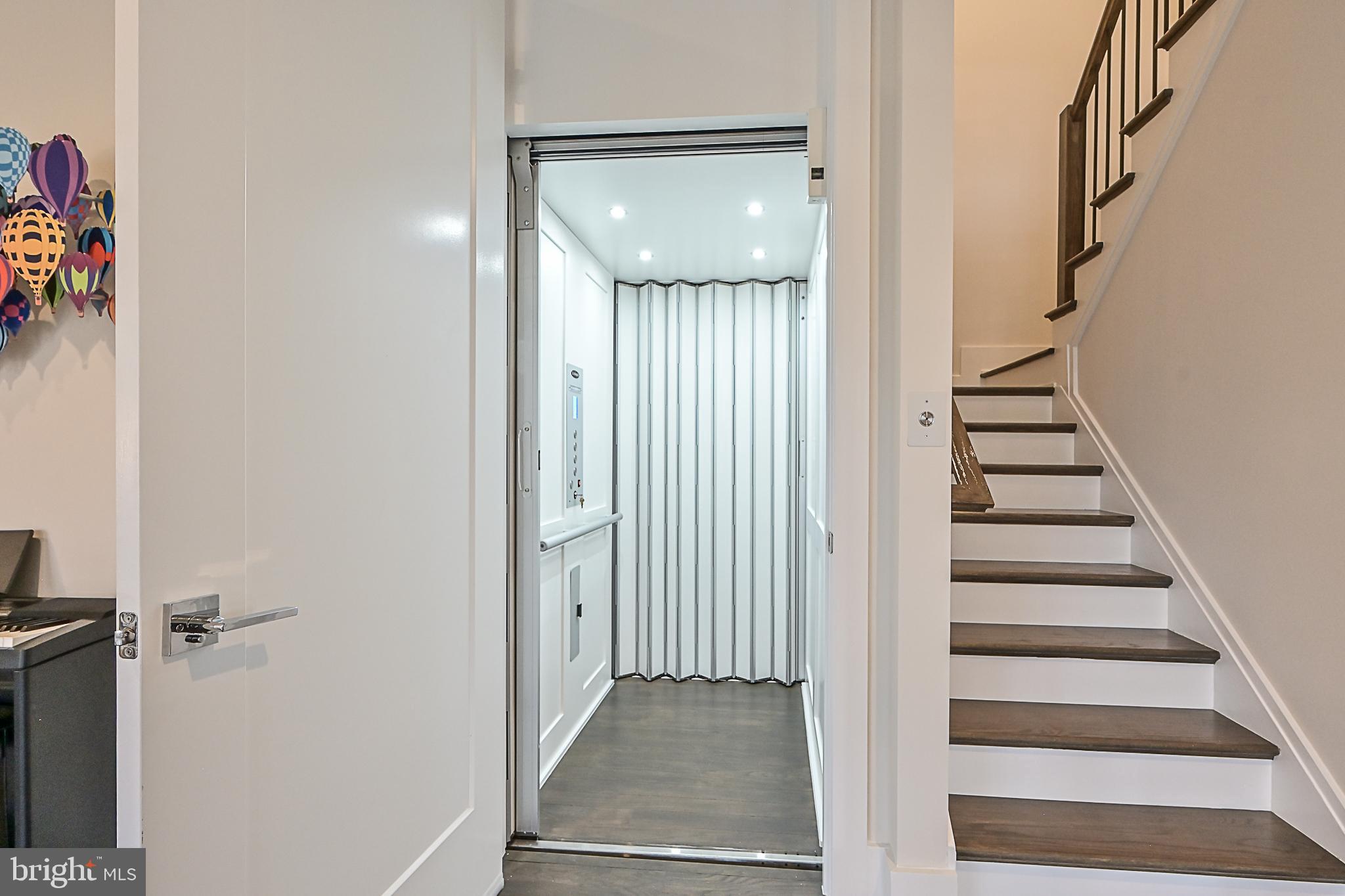 7126 Merrimac Drive McLean, VA 22101 - Photo 62 of 98 a view of a hallway with staircase and white walls
