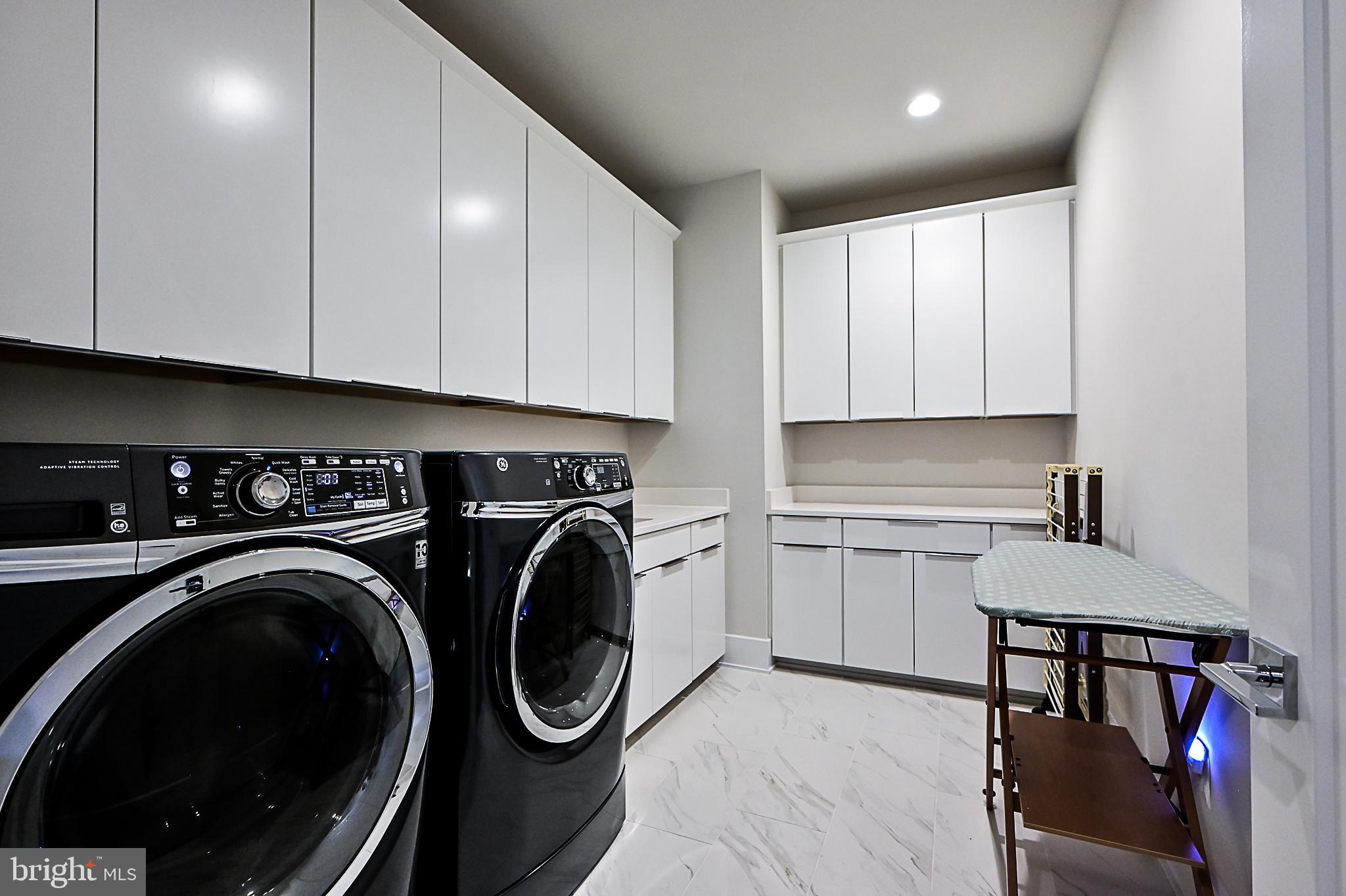 7126 Merrimac Drive McLean, VA 22101 - Photo 74 of 98 a utility room with sink dryer and washer