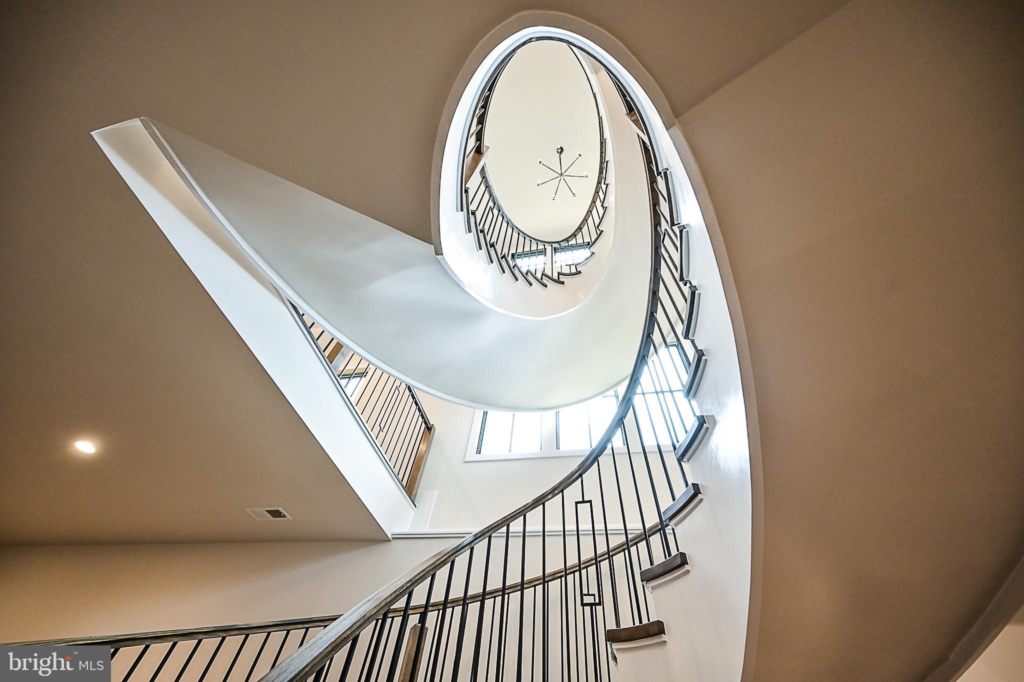 7126 Merrimac Drive McLean, VA 22101 - Photo 78 of 98 a view of staircase with railing and a potted plant