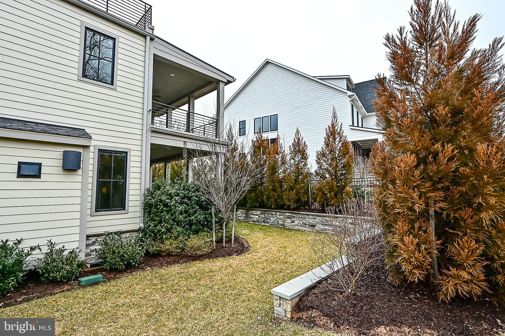 7126 Merrimac Drive McLean, VA 22101 - Photo 9 of 98 a view of a house with backyard and sitting area
