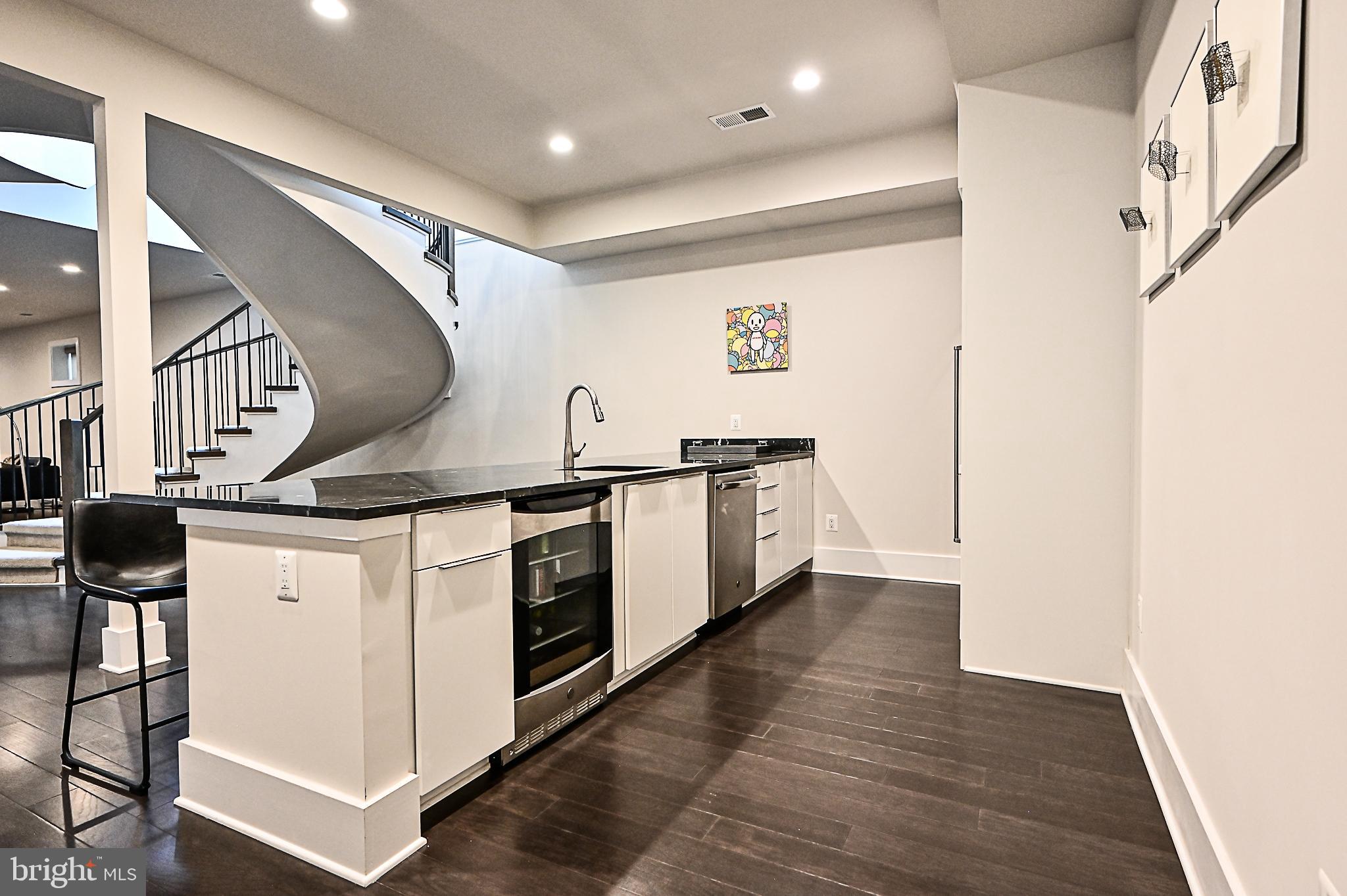 7126 Merrimac Drive McLean, VA 22101 - Photo 82 of 98 a kitchen with stainless steel appliances granite countertop a stove and a sink