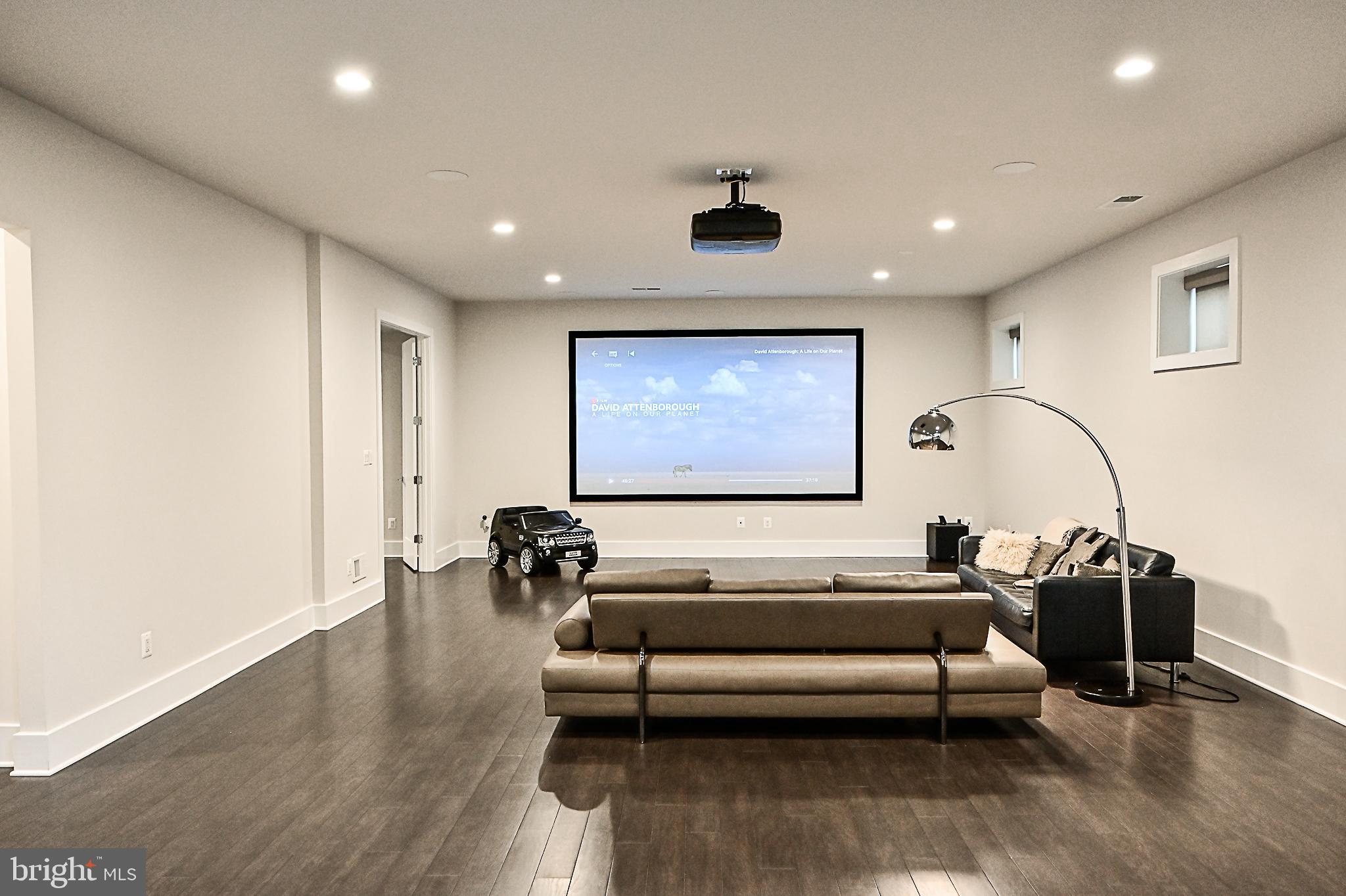 7126 Merrimac Drive McLean, VA 22101 - Photo 88 of 98 a living room with furniture and a flat screen tv