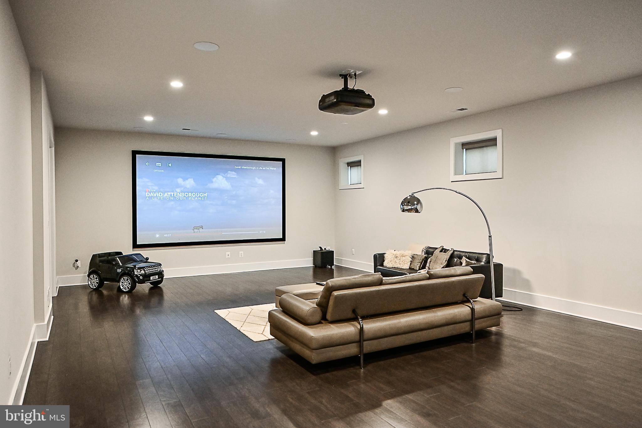 7126 Merrimac Drive McLean, VA 22101 - Photo 89 of 98 a living room with furniture and a flat screen tv
