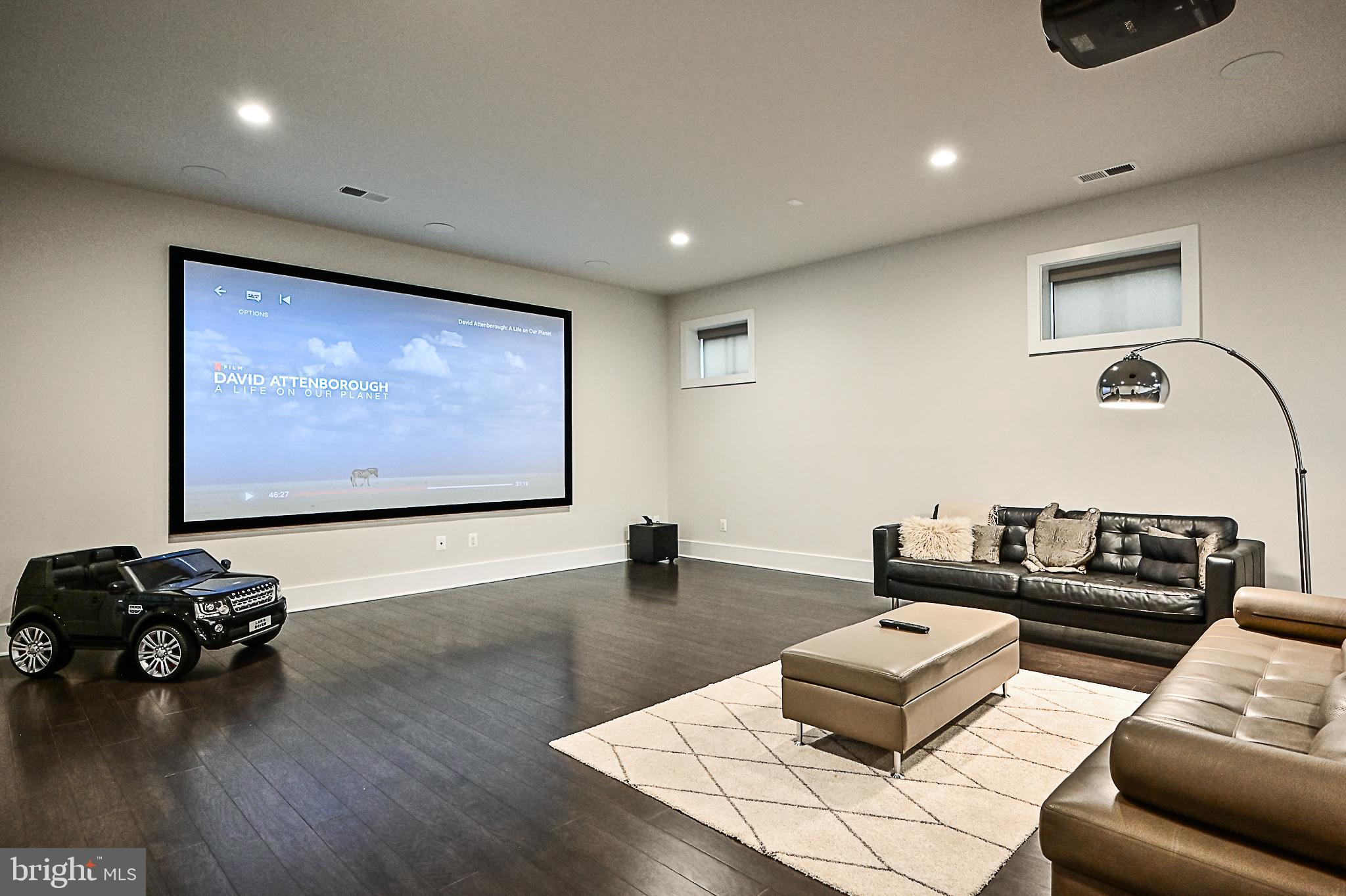 7126 Merrimac Drive McLean, VA 22101 - Photo 90 of 98 a living room with furniture and a flat screen tv
