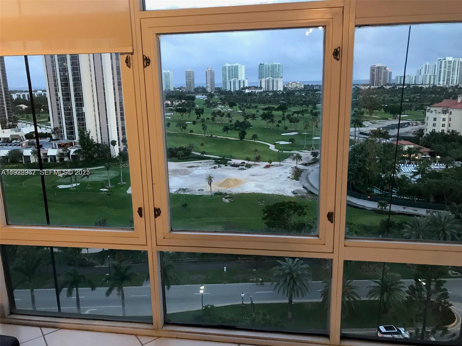 20100 West Country Club Drive, Unit 1606 Aventura, FL 33180 - Photo 9 of 10 a view of a glass door