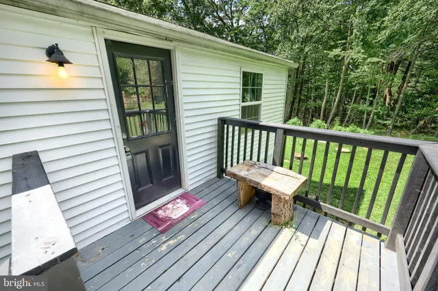 a view of a two chairs on the roof deck