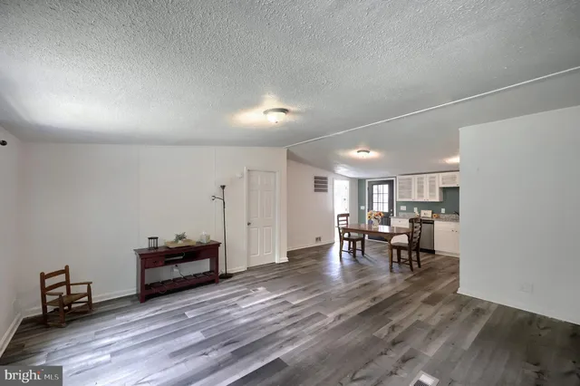 a view of dining room with furniture and wooden floor