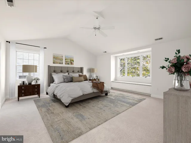 a spacious bathroom with a double vanity sink a large mirror and a bathtub
