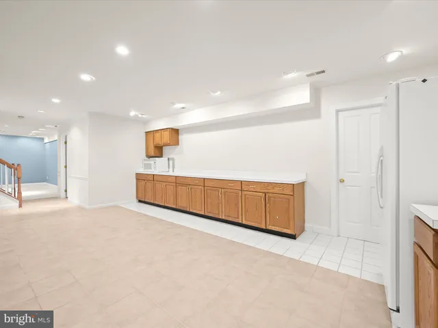 a view of balcony with wooden floor and fence
