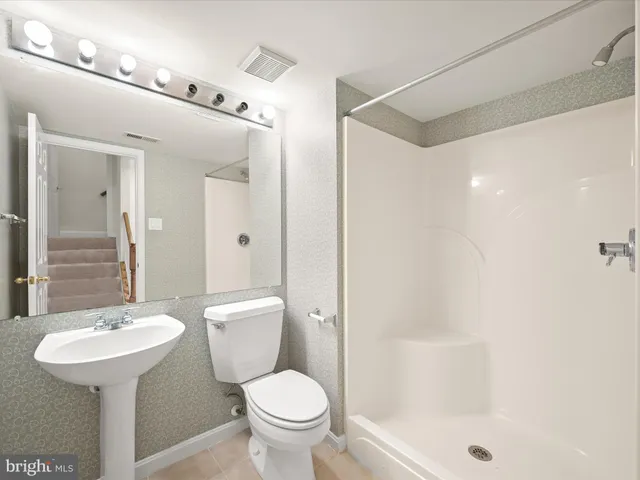 a picture of a bench in front of a building