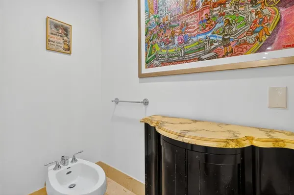 a living room with furniture and flowers