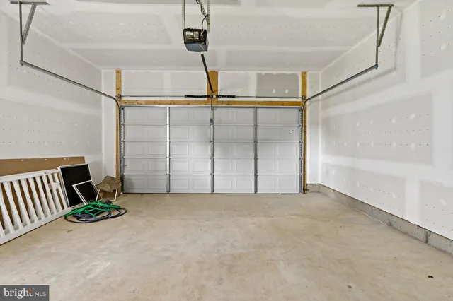 a view of a house with pool and a yard