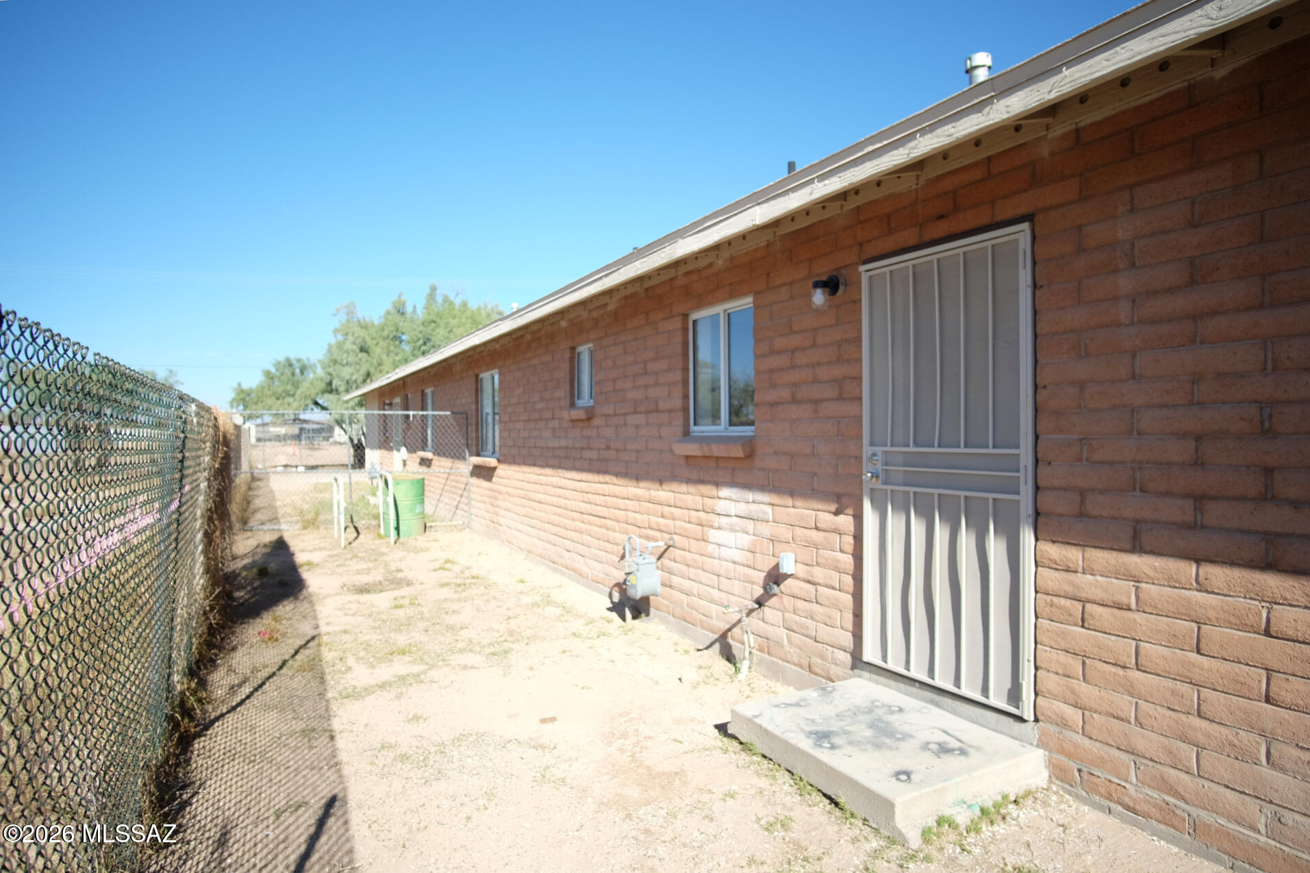 345 East Delta Road Tucson, AZ 85706 - Photo 27 of 45 a view of a backyard with a wooden fence