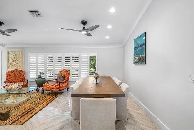 a living room with stainless steel appliances kitchen island granite countertop furniture and a kitchen view
