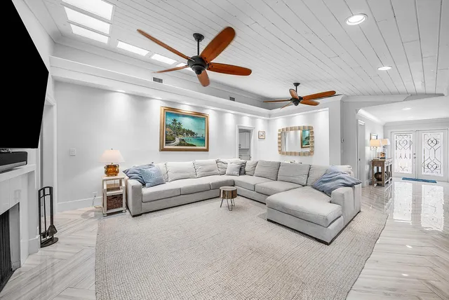 a bedroom with a large bed and a large window