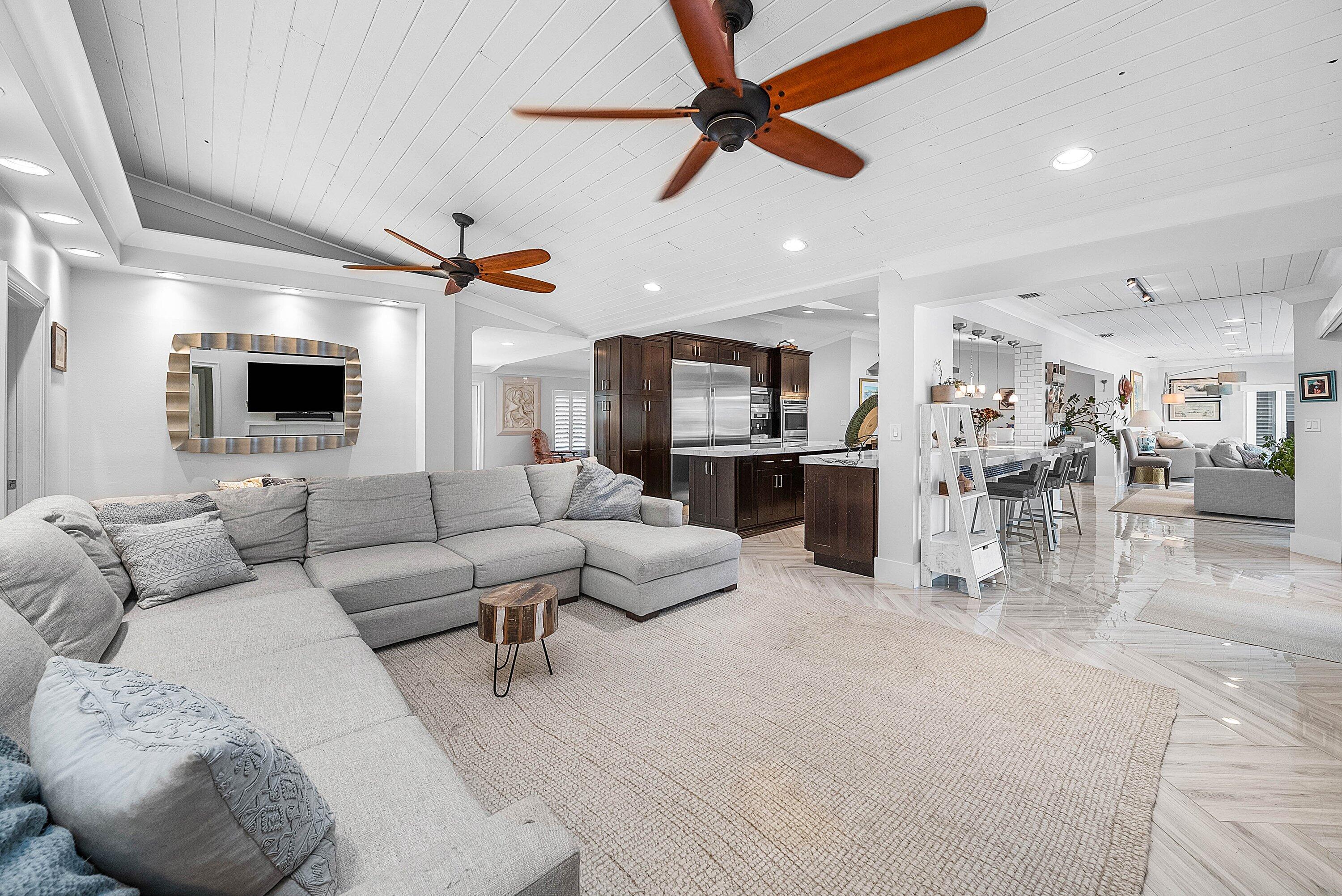 7425 Northeast Bay Cove Court Boca Raton, FL 33487 - Photo 22 of 86 a living room with furniture kitchen view and a wooden floor