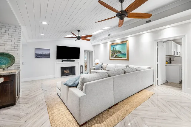 a bathroom with a granite countertop sink a mirror and a shower