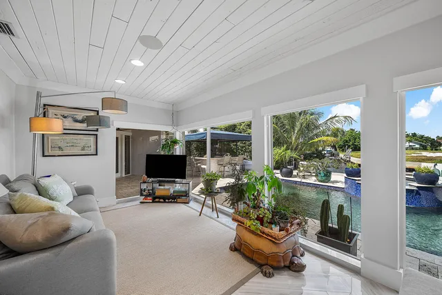 a view of a living room and a wooden floor