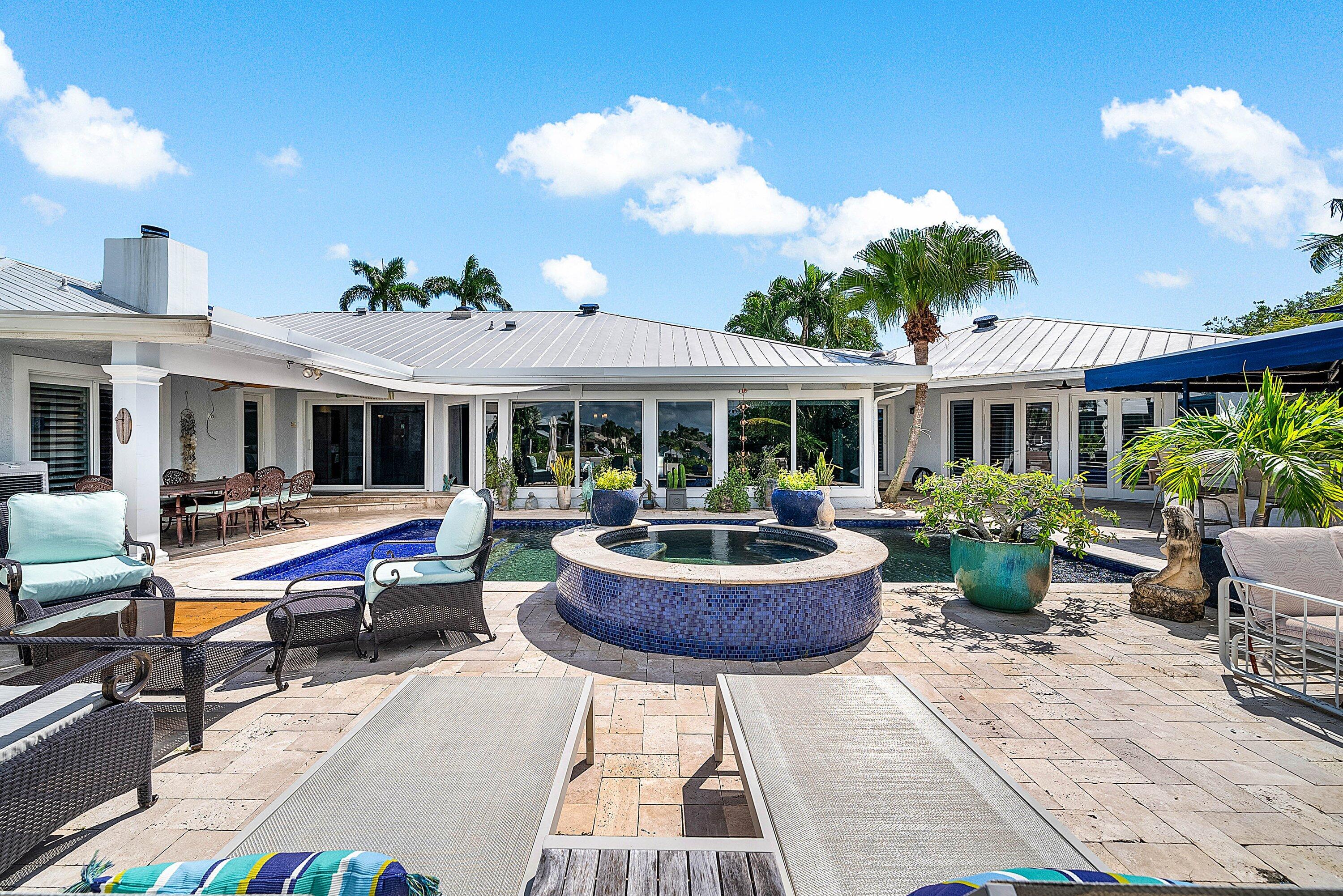 7425 Northeast Bay Cove Court Boca Raton, FL 33487 - Photo 33 of 86 Backyard Entertaining Area