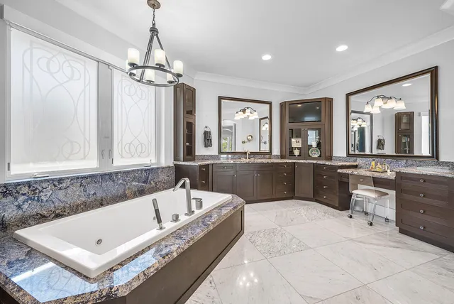 a bedroom with a bed and flat screen tv