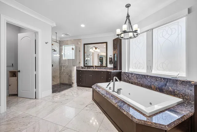 a bathroom with a sink mirror and toilet
