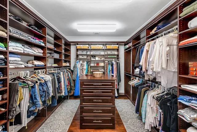 a view of a house with backyard sitting area and garden