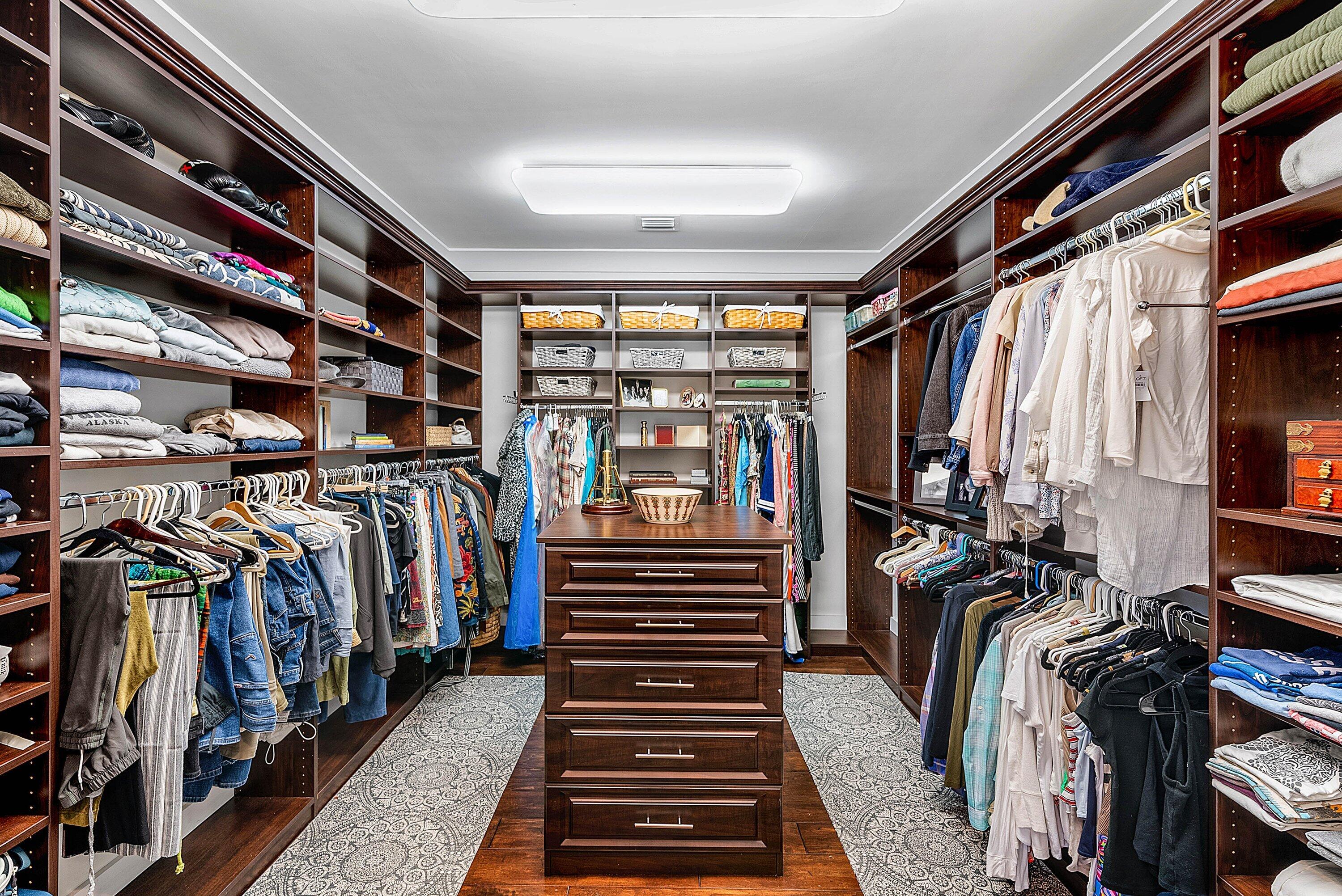 7425 Northeast Bay Cove Court Boca Raton, FL 33487 - Photo 42 of 86 a view of walk in closet with clothes and shoes