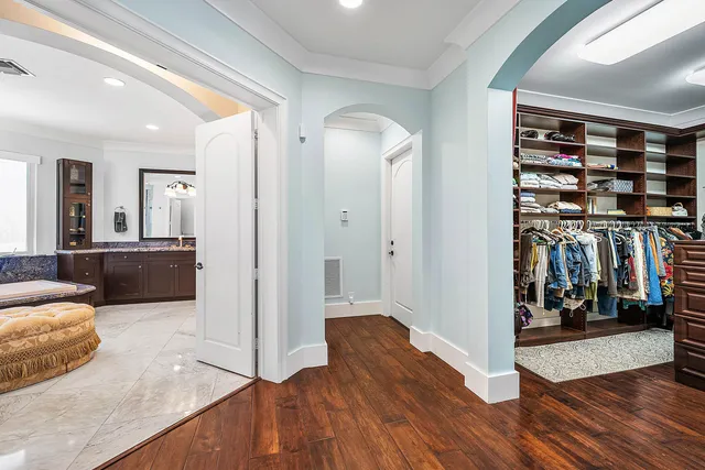 a view of patio with table and chairs under an umbrella
