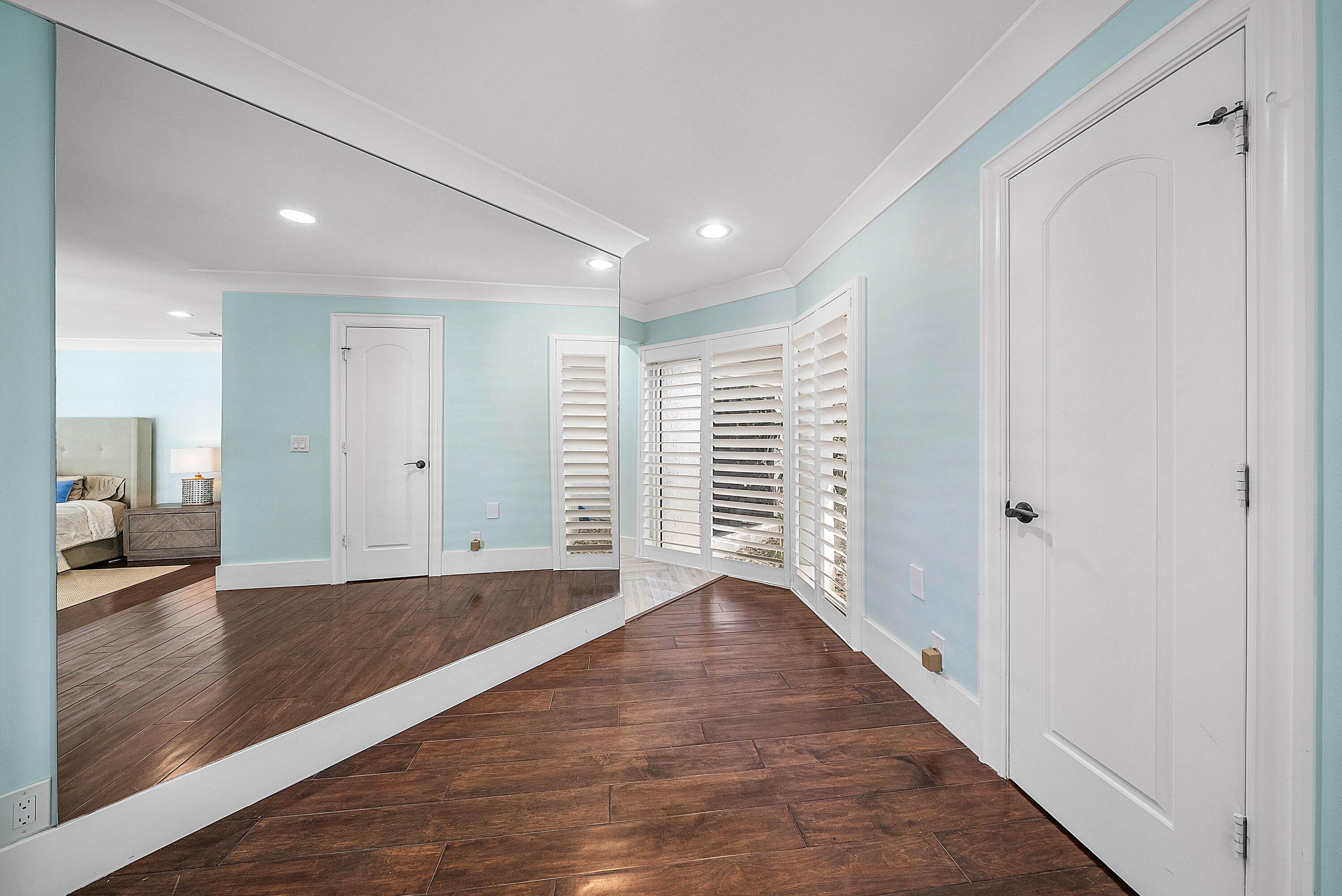 7425 Northeast Bay Cove Court Boca Raton, FL 33487 - Photo 46 of 86 a view of an empty room with wooden floor and a window