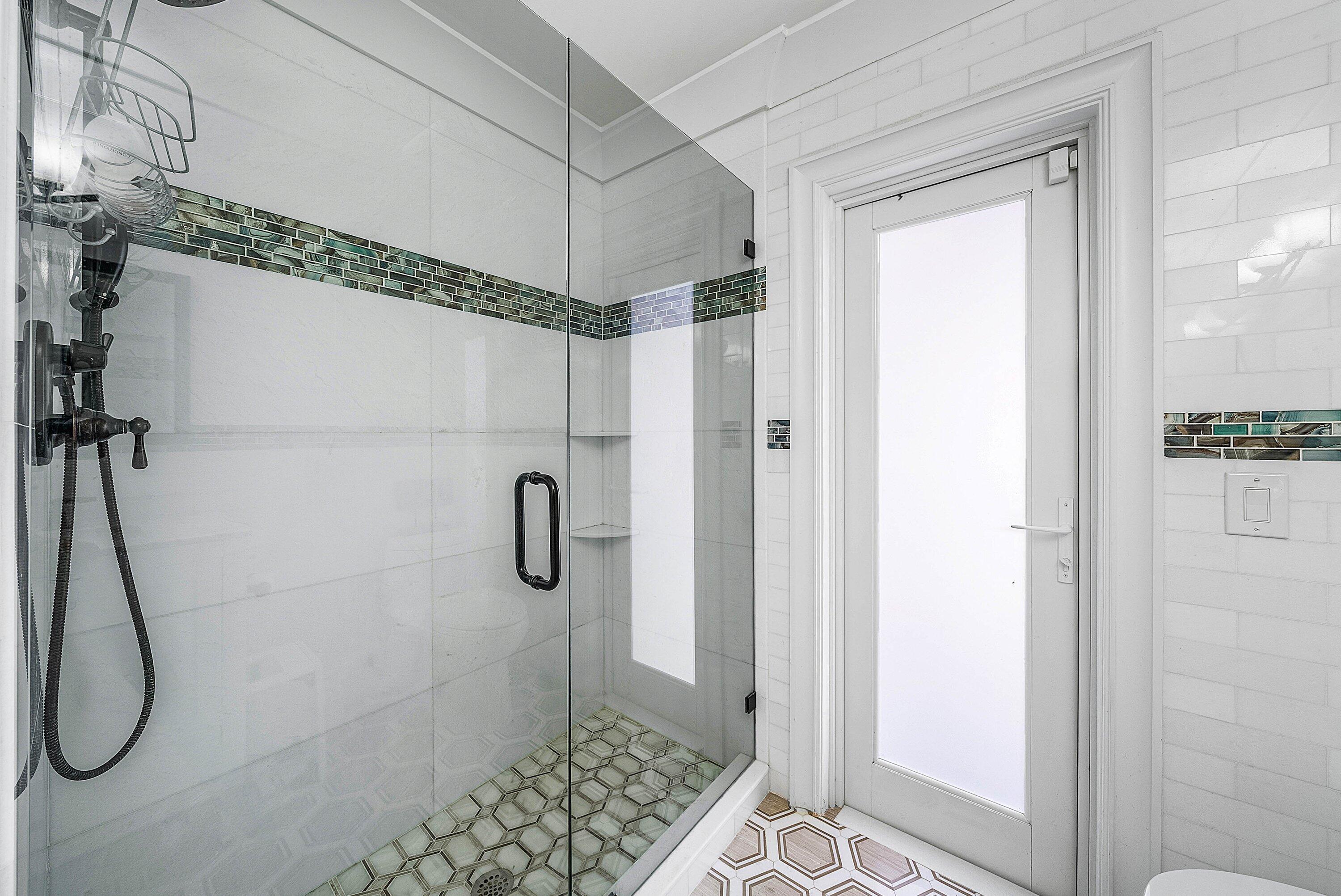 7425 Northeast Bay Cove Court Boca Raton, FL 33487 - Photo 58 of 86 a bathroom with a shower