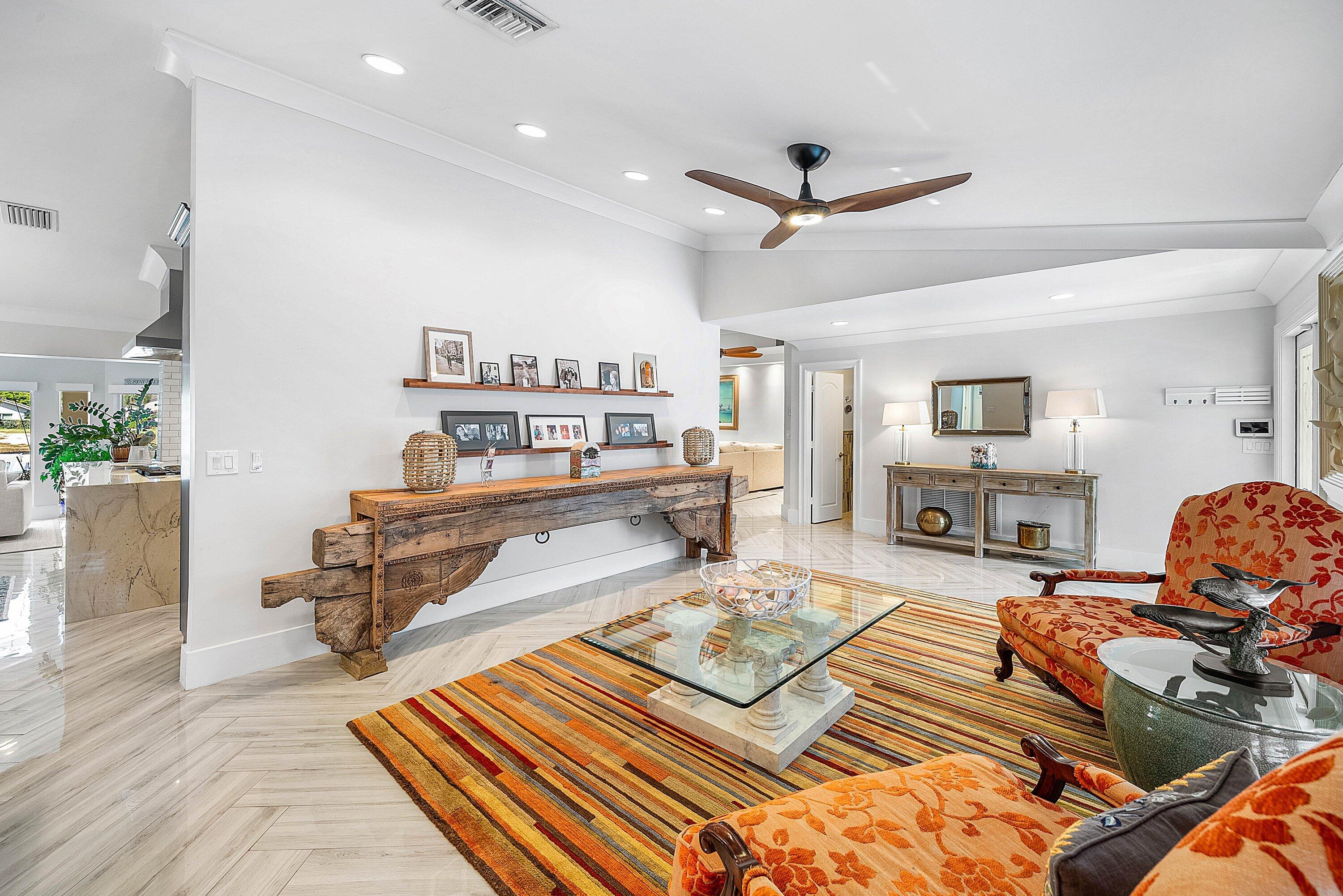 7425 Northeast Bay Cove Court Boca Raton, FL 33487 - Photo 10 of 86 a living room with furniture and a rug