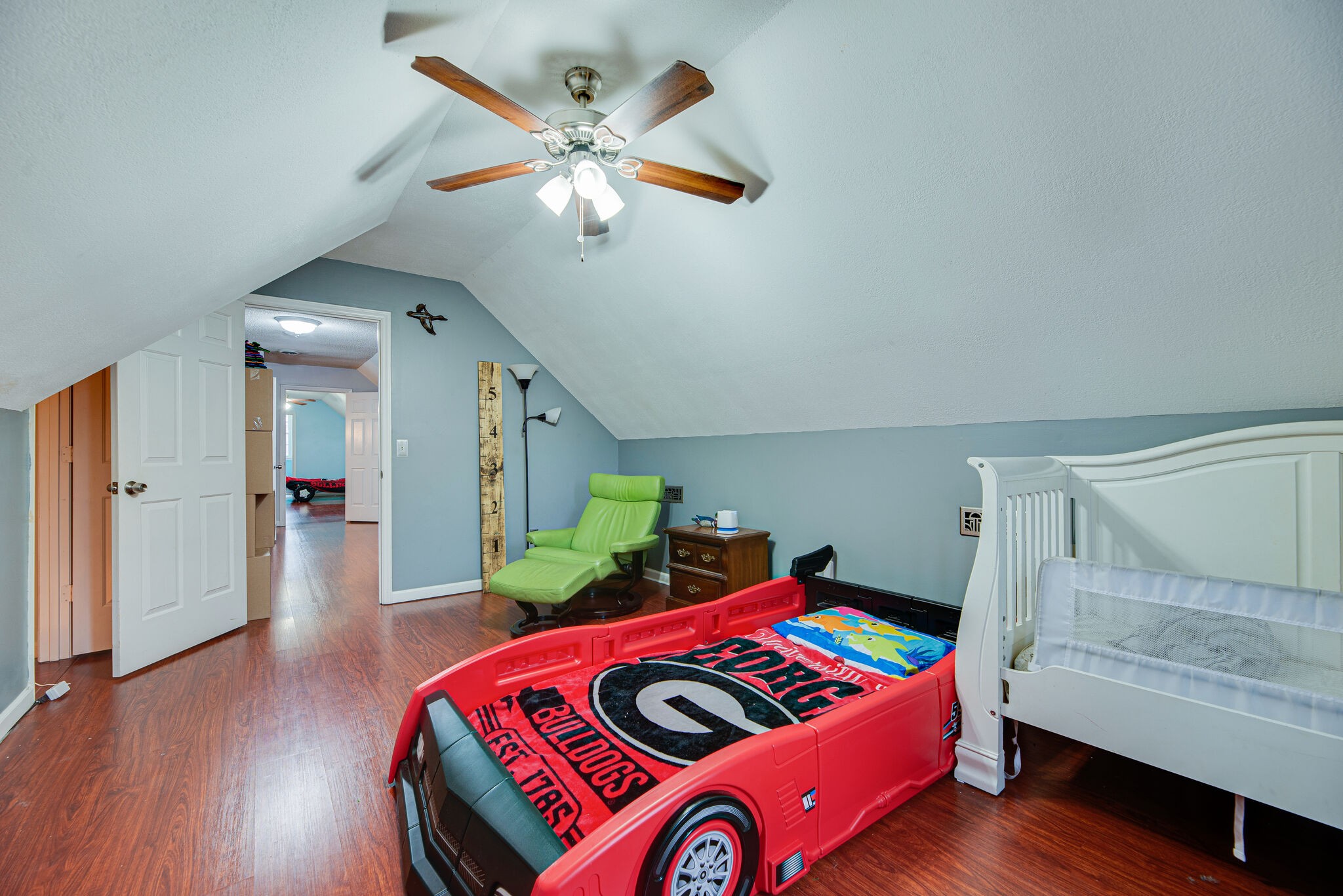 5140 East Calgary Murfreesboro, TN 37129 - Photo 26 of 30 a bedroom with a bed and wooden floor