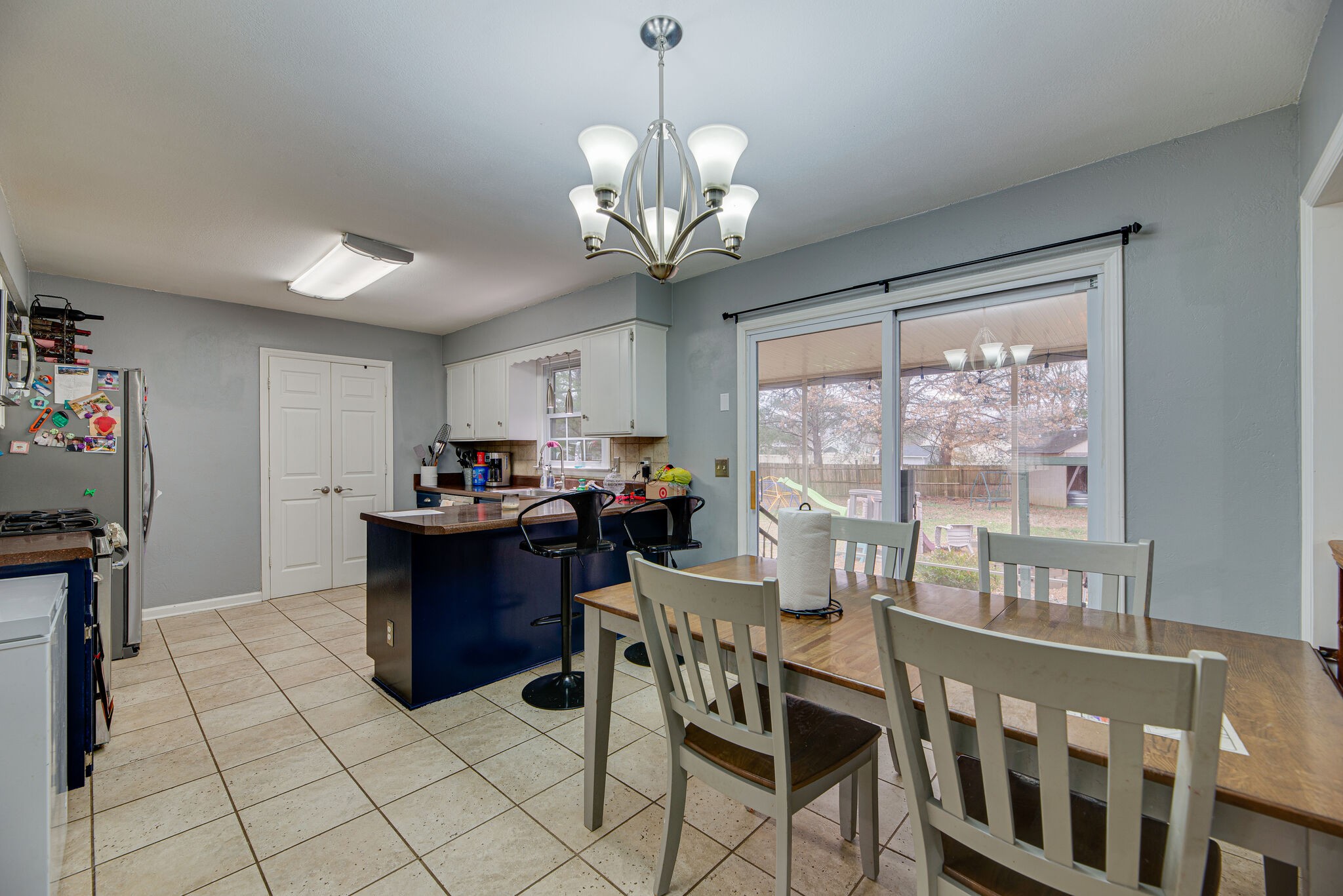 5140 East Calgary Murfreesboro, TN 37129 - Photo 8 of 30 a view of a dining room with furniture a chandelier and a window