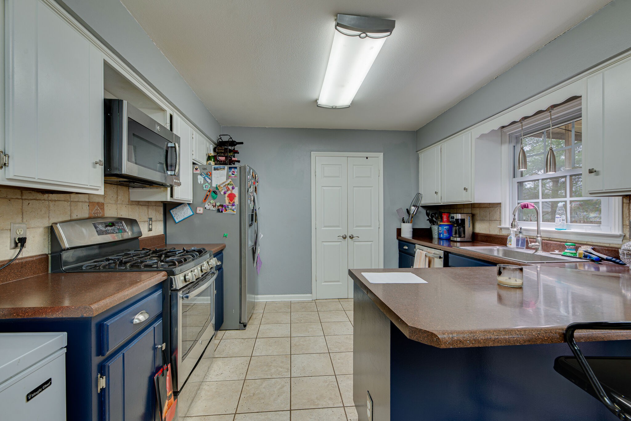 5140 East Calgary Murfreesboro, TN 37129 - Photo 9 of 30 a kitchen with stainless steel appliances granite countertop a sink a stove and a refrigerator