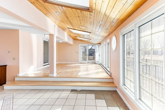 a view of a porch with wooden floor and fence