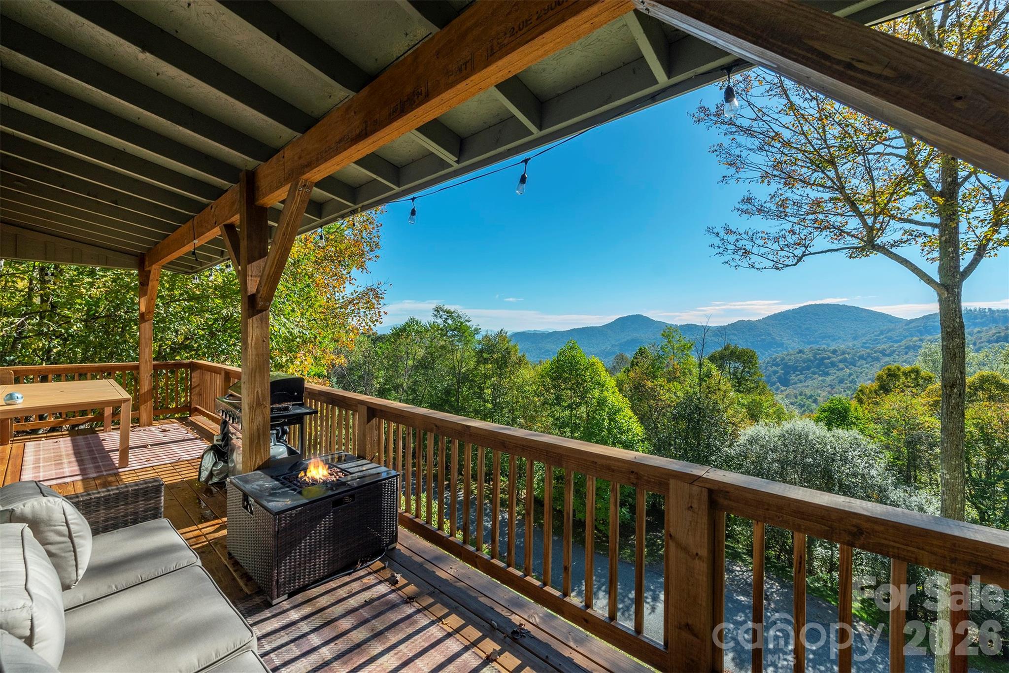 322 Goldenleaf Road Mars Hill, NC 28754 - Photo 2 of 47 a view of balcony with couches and wooden floor