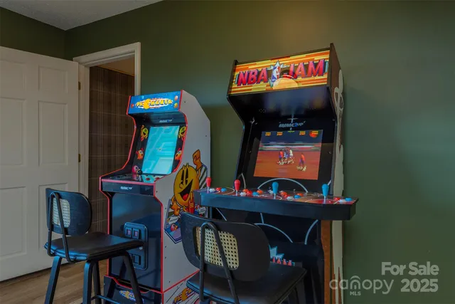 a view of a room with furniture and wooden floor