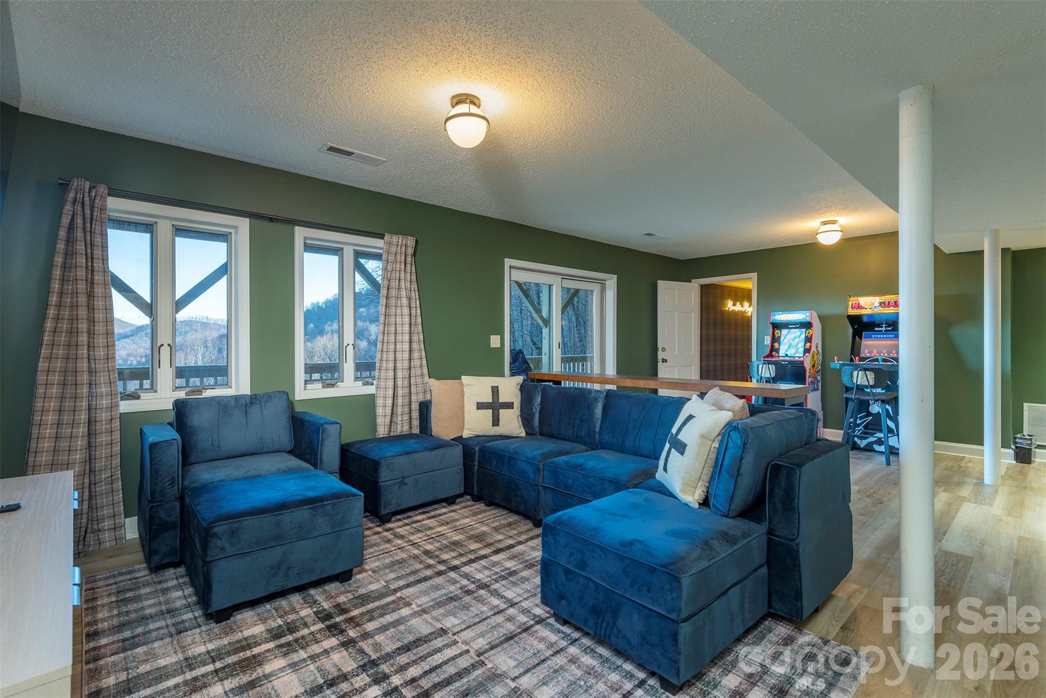 322 Goldenleaf Road Mars Hill, NC 28754 - Photo 32 of 47 a living room with furniture and a large window