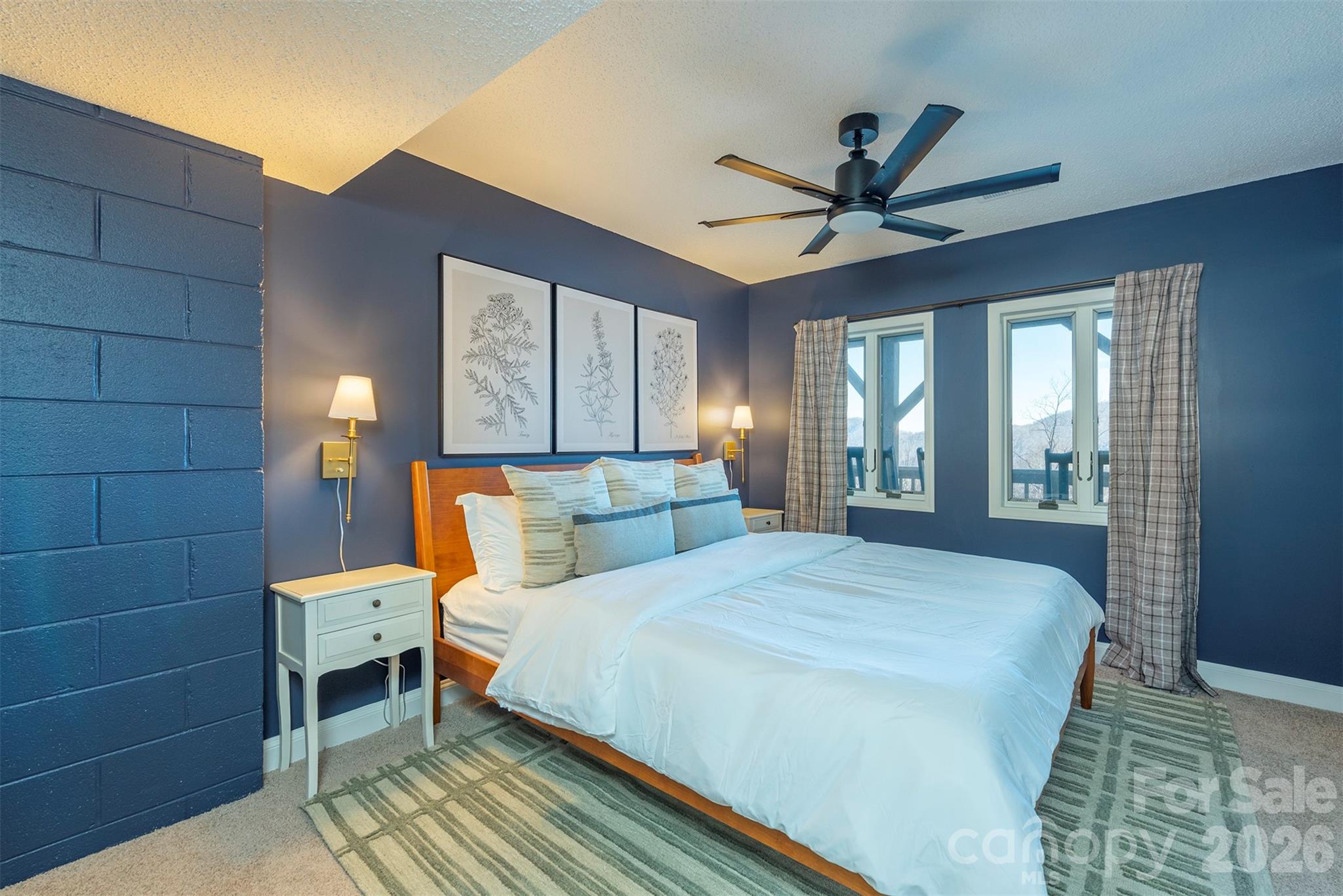 322 Goldenleaf Road Mars Hill, NC 28754 - Photo 33 of 47 a bed room with a bed and a chandelier