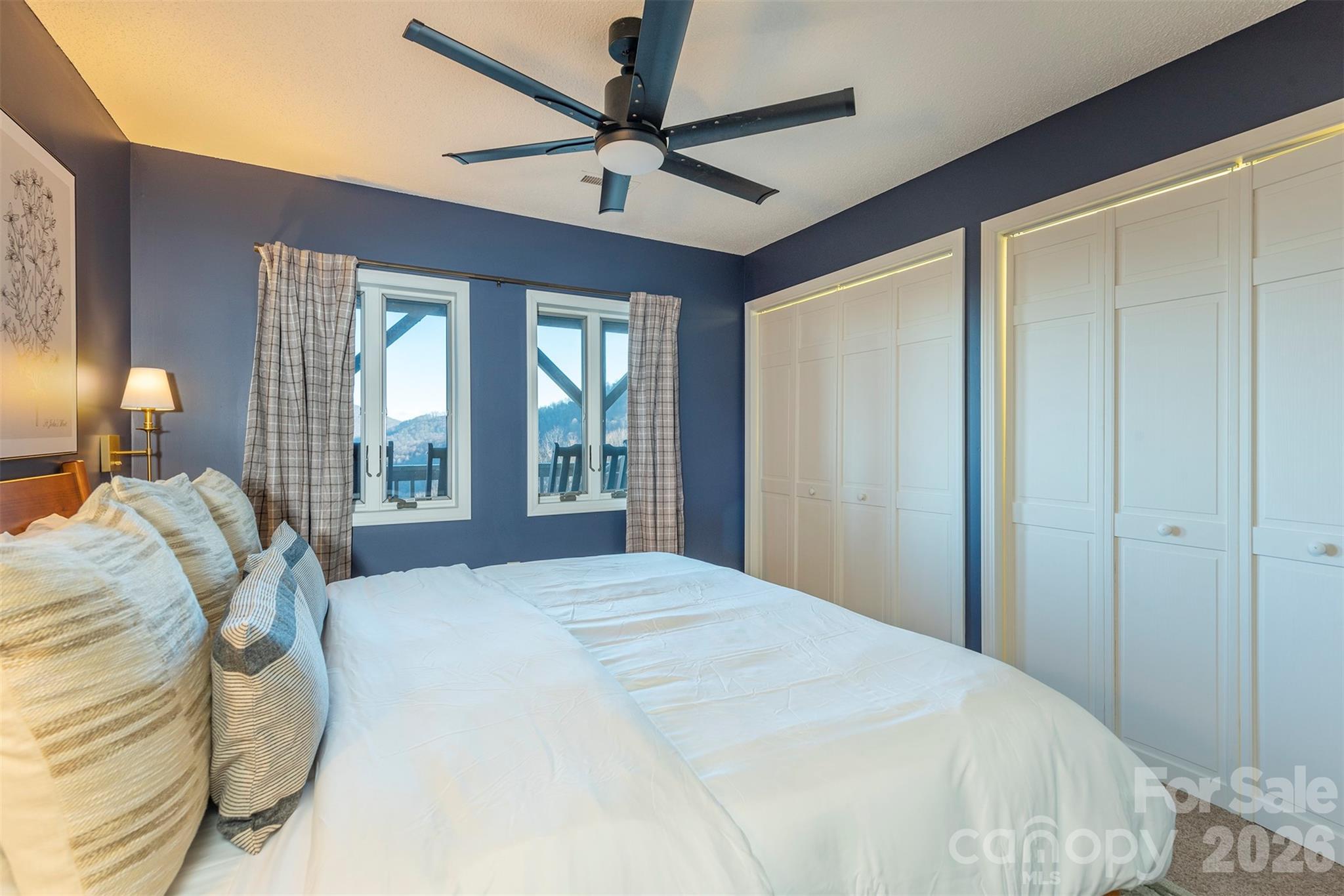 322 Goldenleaf Road Mars Hill, NC 28754 - Photo 34 of 47 a bedroom with a bed ceiling fan and a window