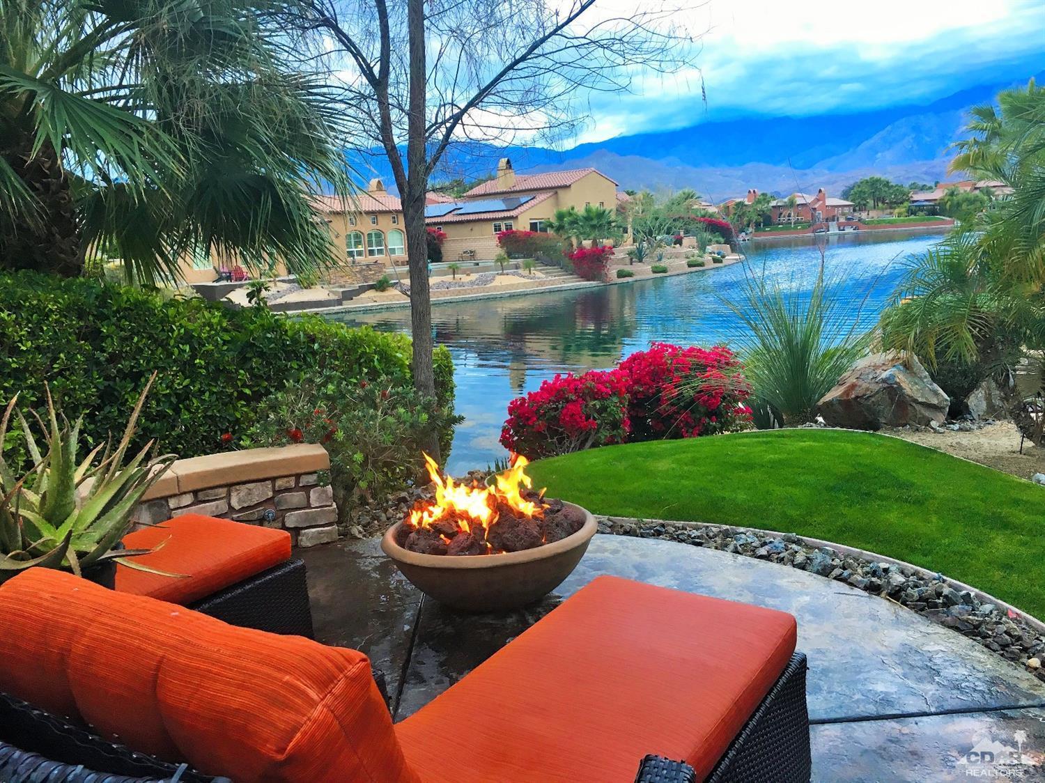 5 Via Santa Velera Rancho Mirage, CA 92270 - Photo 2 of 90 a view of a backyard with plants and a patio