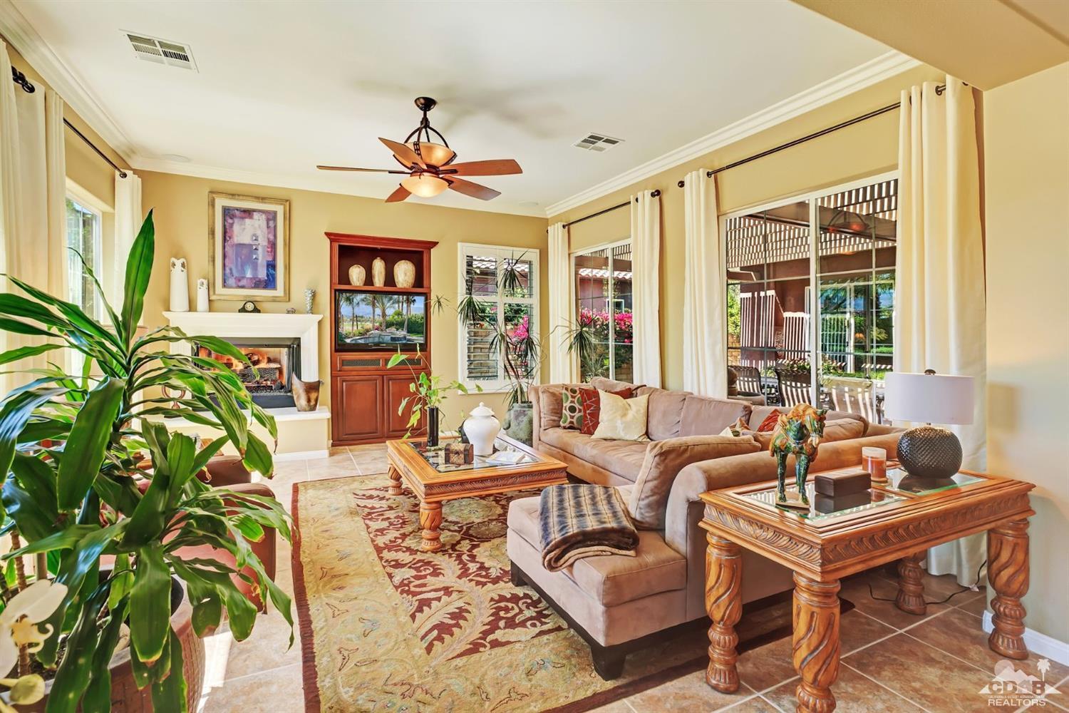 5 Via Santa Velera Rancho Mirage, CA 92270 - Photo 32 of 90 a living room with patio furniture and a potted plant