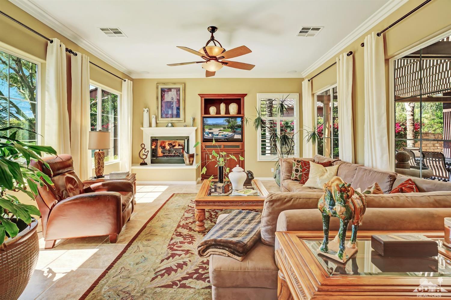 5 Via Santa Velera Rancho Mirage, CA 92270 - Photo 33 of 90 a living room with fireplace furniture and a large window