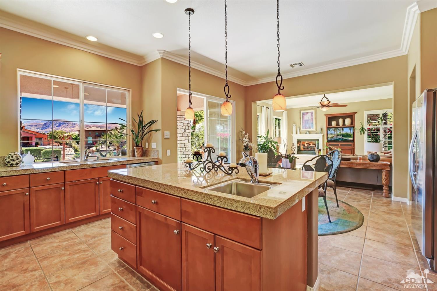 5 Via Santa Velera Rancho Mirage, CA 92270 - Photo 5 of 90 a kitchen with a sink stove and table