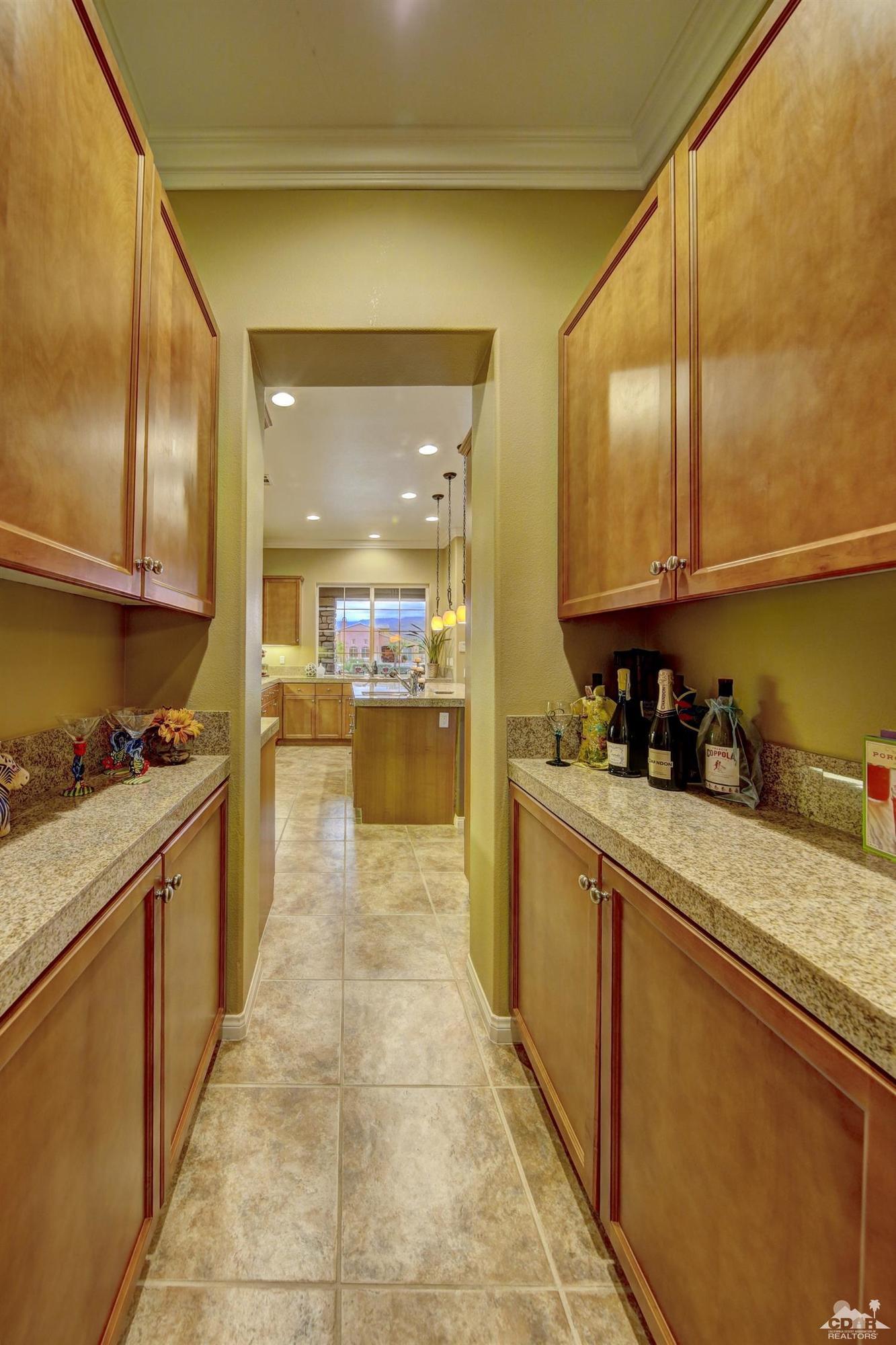 5 Via Santa Velera Rancho Mirage, CA 92270 - Photo 42 of 90 a kitchen with stainless steel appliances granite countertop a stove a sink and a refrigerator