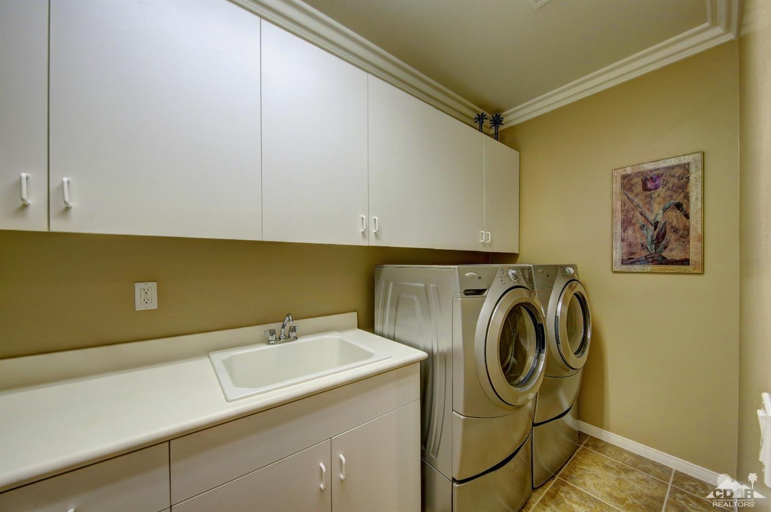 5 Via Santa Velera Rancho Mirage, CA 92270 - Photo 48 of 90 a utility room with dryer and washer